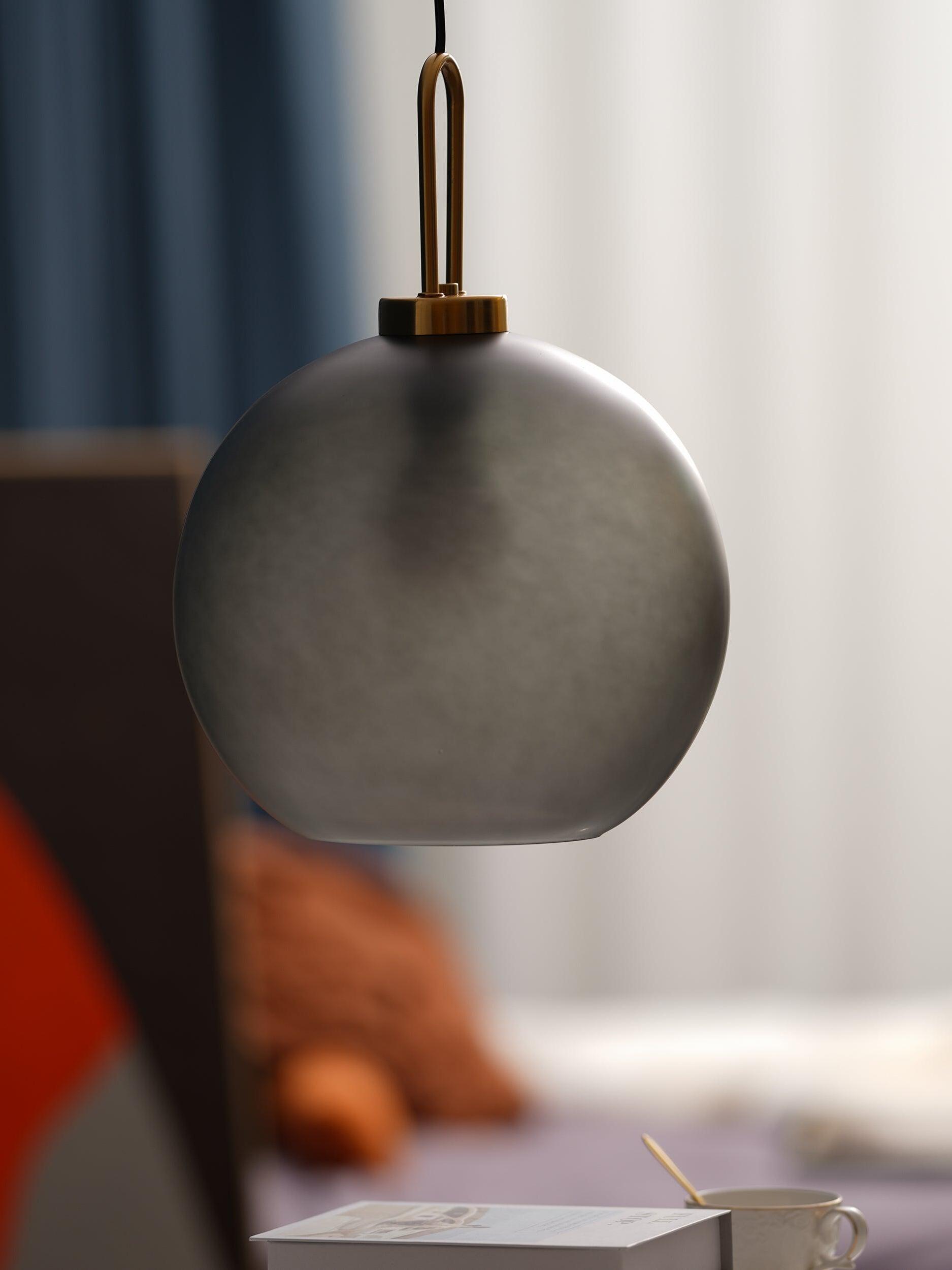 Close view of a frosted globe and metal top loop