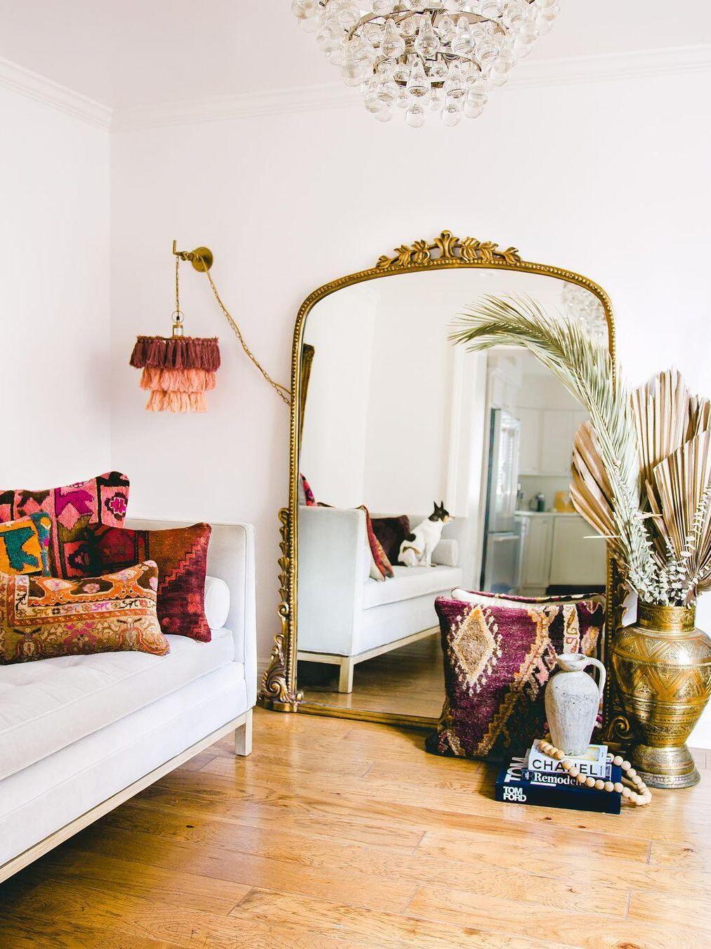 Multicolour tassel fixture beside a large mirror