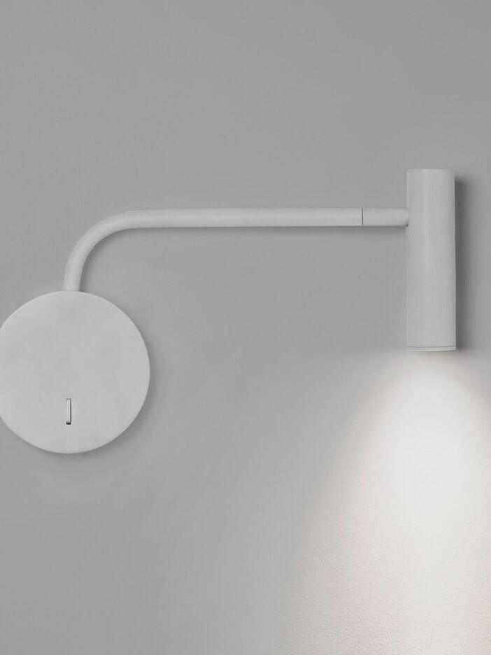 White reading sconce with extended arm and cylindrical head