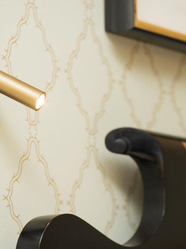 Copper-coloured reading head projecting from a wall