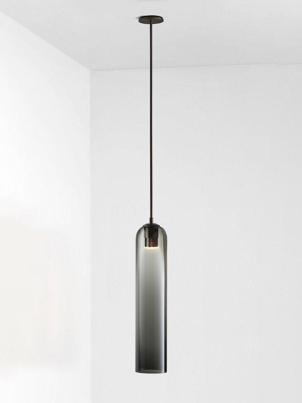 Spray gray glass Long Tube pendant with black rod and canopy, with socket and light visible through the smoky shade