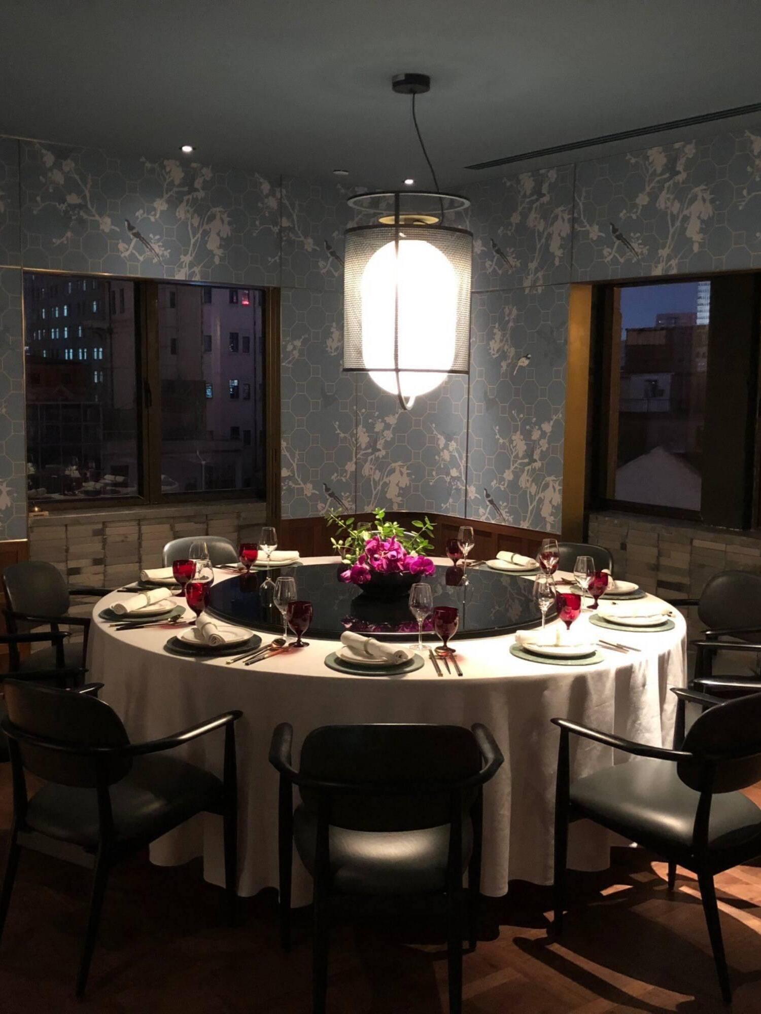 Black mesh pendant above a restaurant dining table