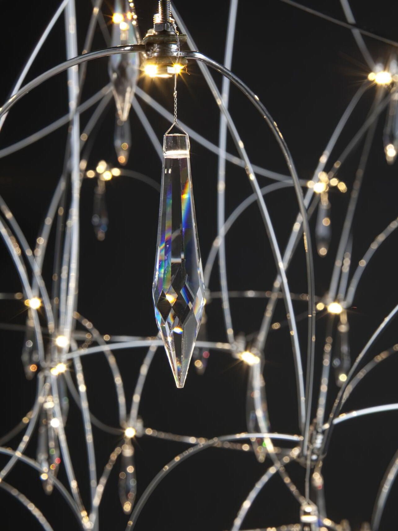 Silver curved metal lines and crystal drops