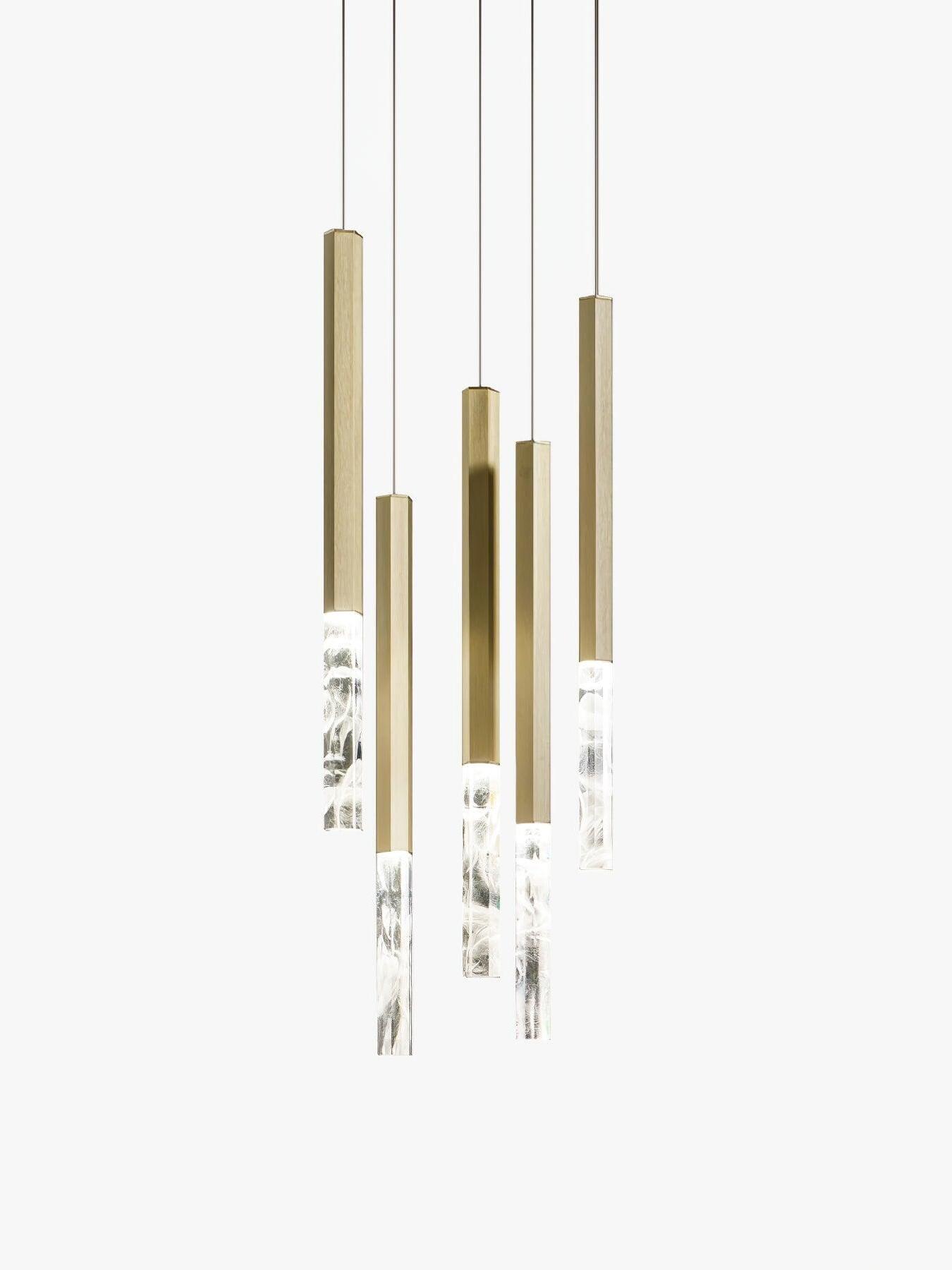 Five vertical gold-tone elements with clear crystal ends
