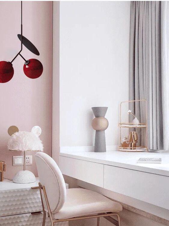 Red rounded shades above an indoor vanity area