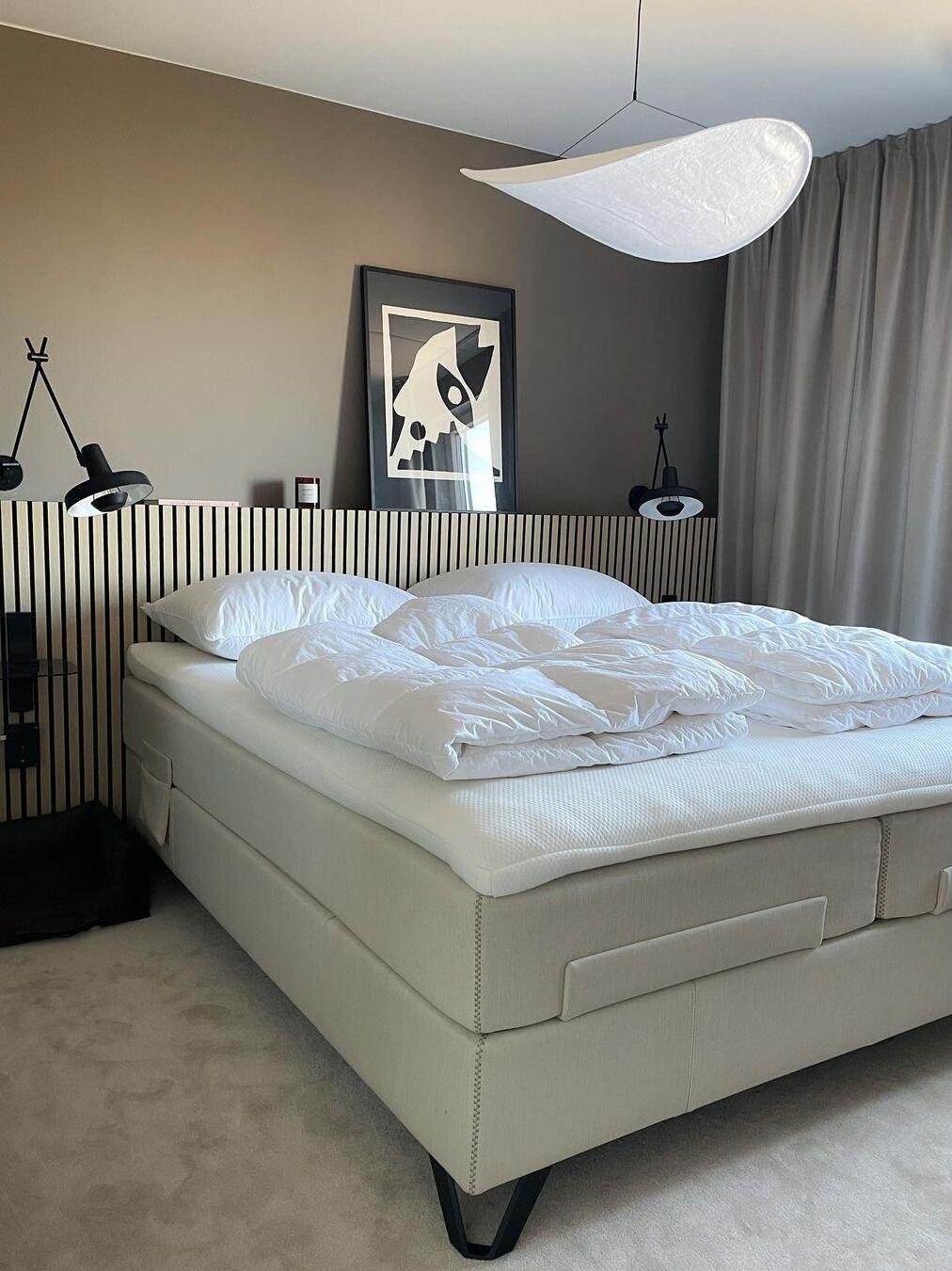 Cloud-like pendant above a bed