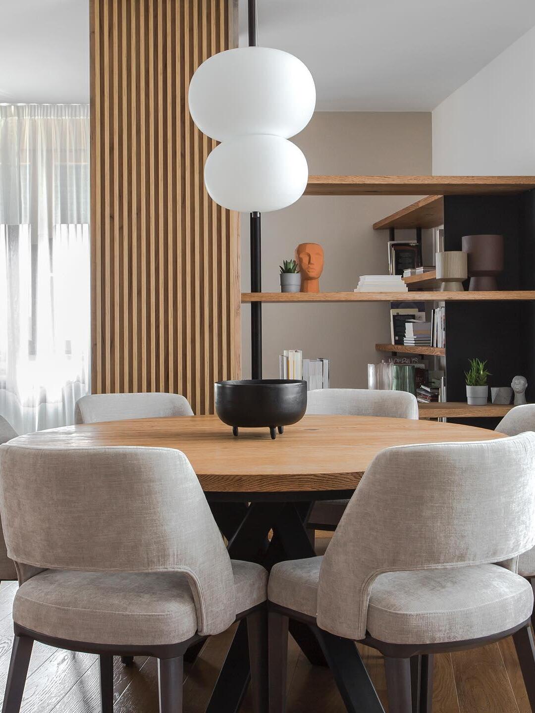 Two-globe pendant above a dining table