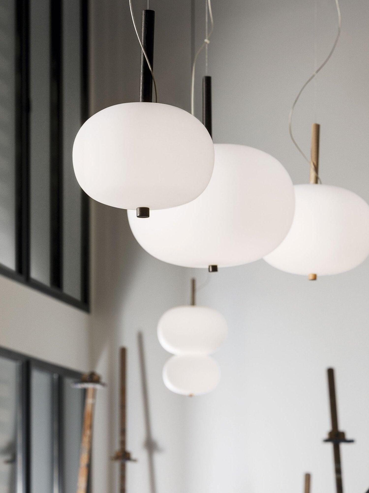 Single and stacked white globes displayed together