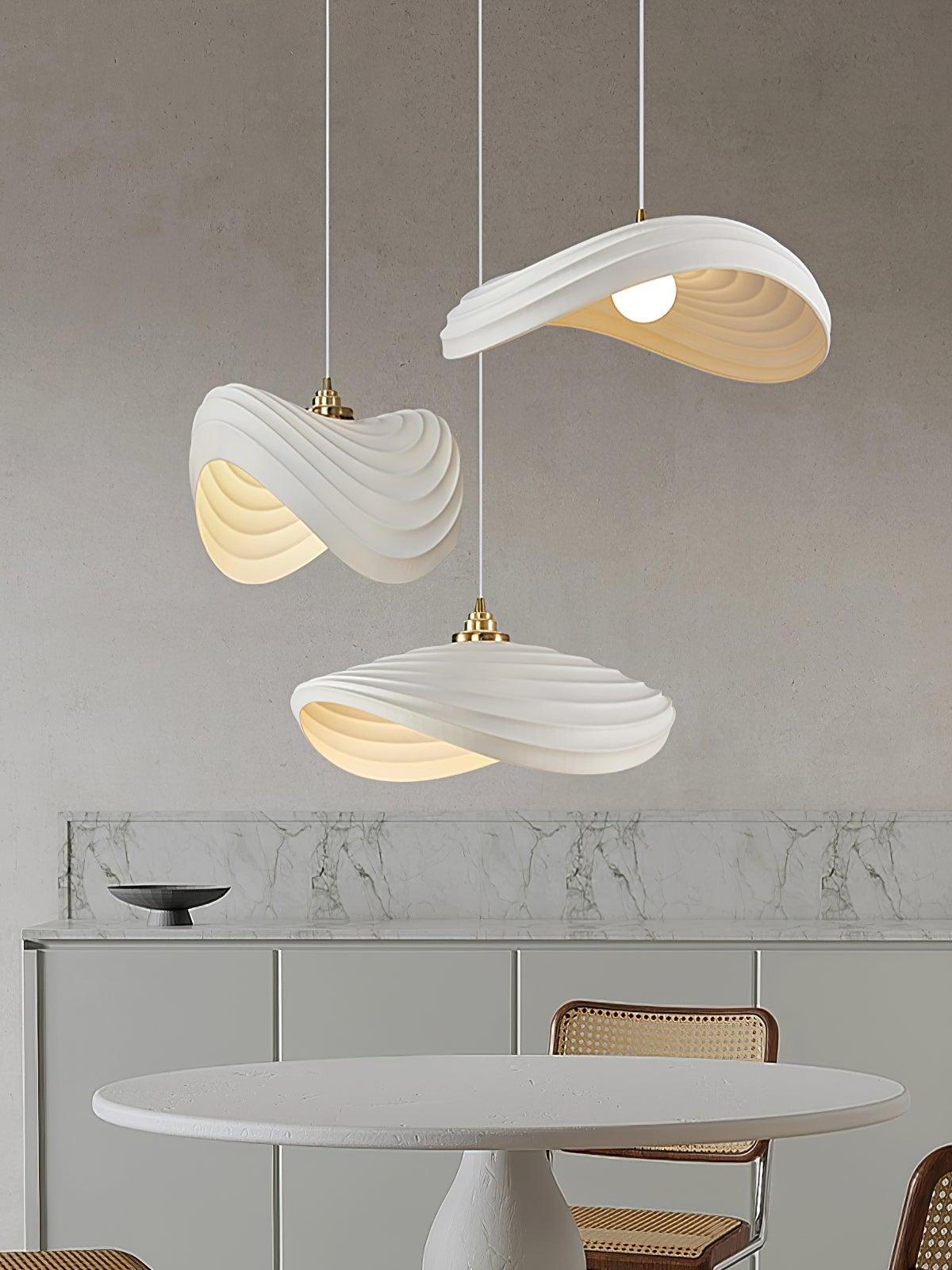Three separate Navicula pendants above a round table
