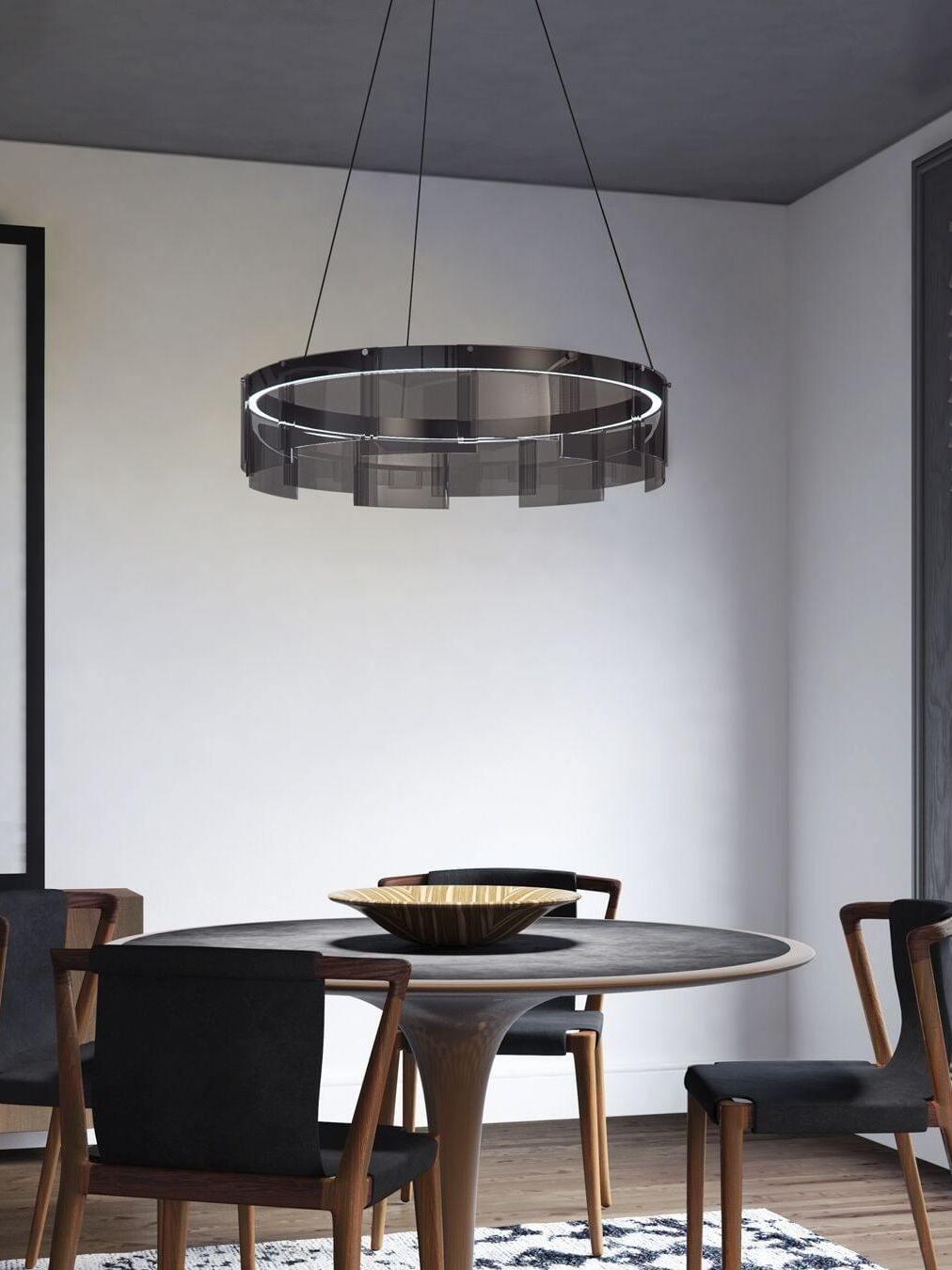 Glass ring chandelier over a round wooden table