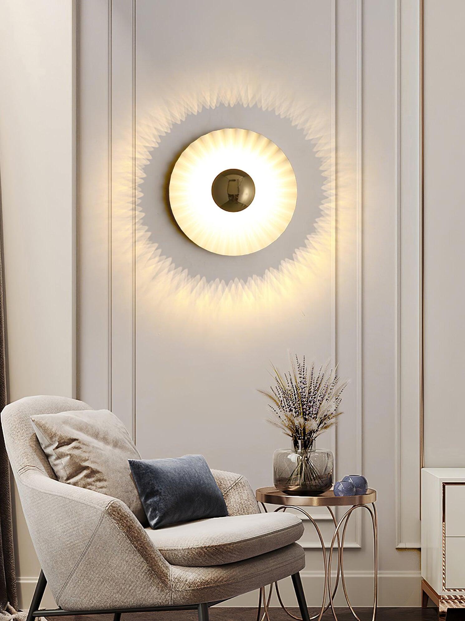 White radial wall disc glowing over pale chair