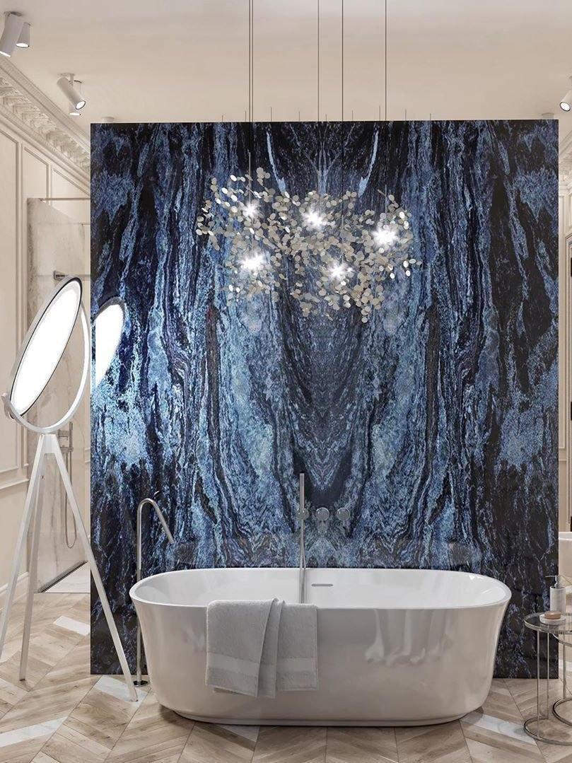 Silver disc-cluster fixture pictured above a freestanding bath