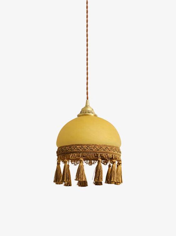 Single yellow dome tassel pendant on hanging cord
