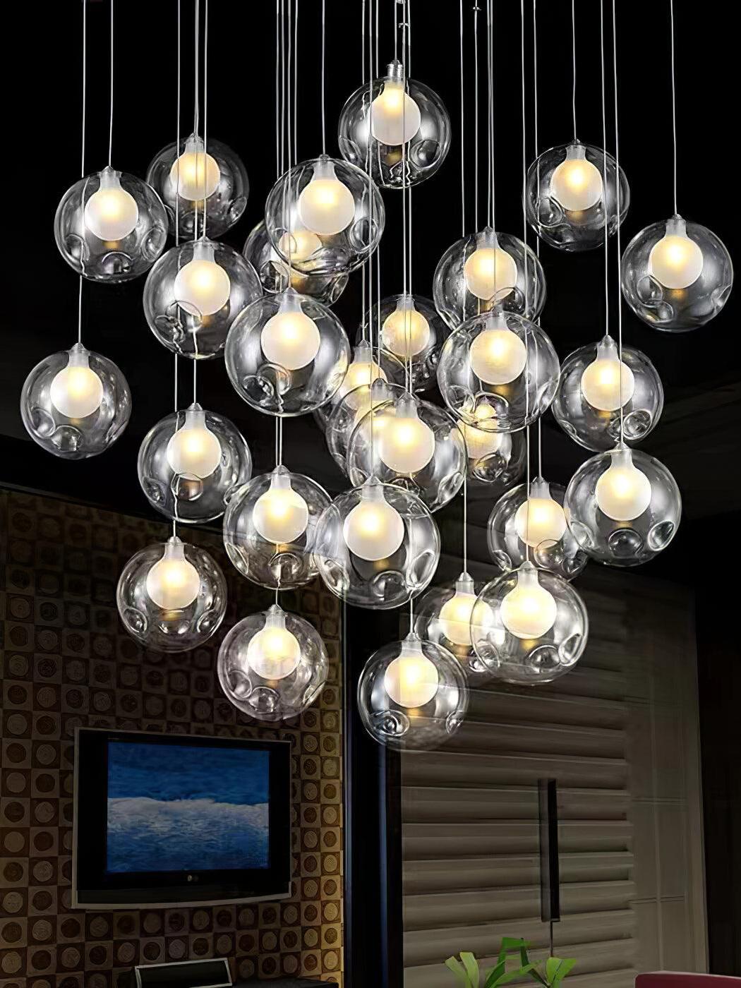 Dense group of clear globes lit below dark ceiling