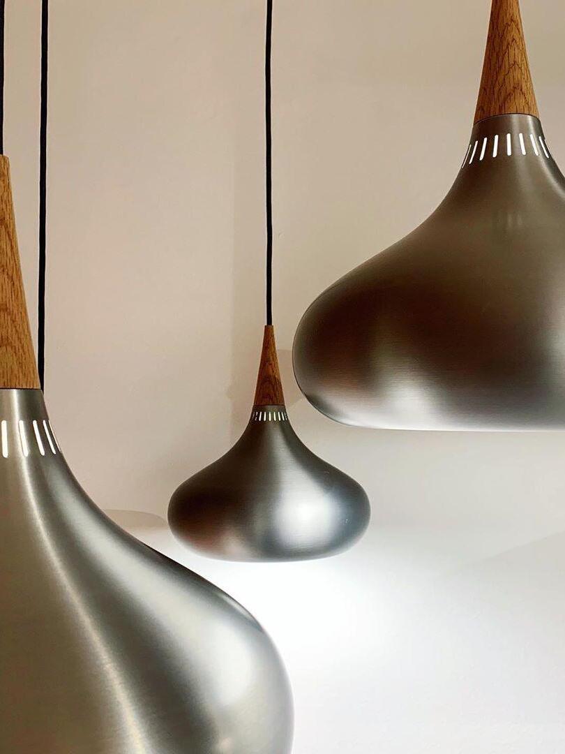 Close-up of silver-toned shades and wood-grain necks