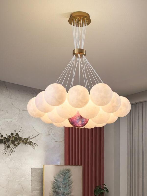 Glowing moon-textured sphere cluster suspended from a round canopy