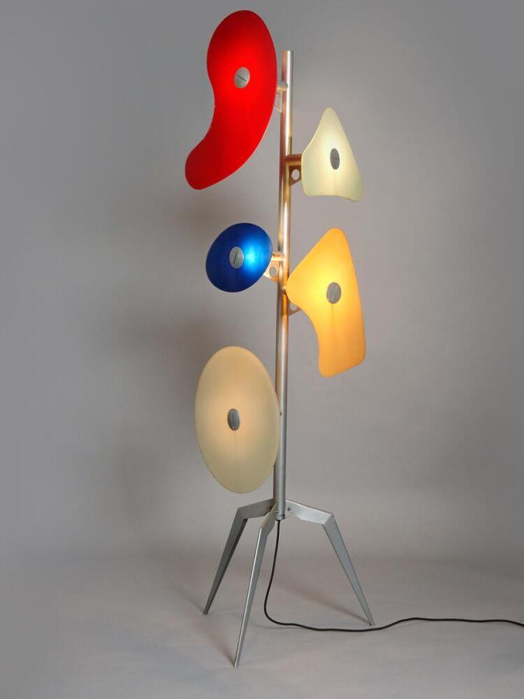Angled view of illuminated multicolour floor lamp