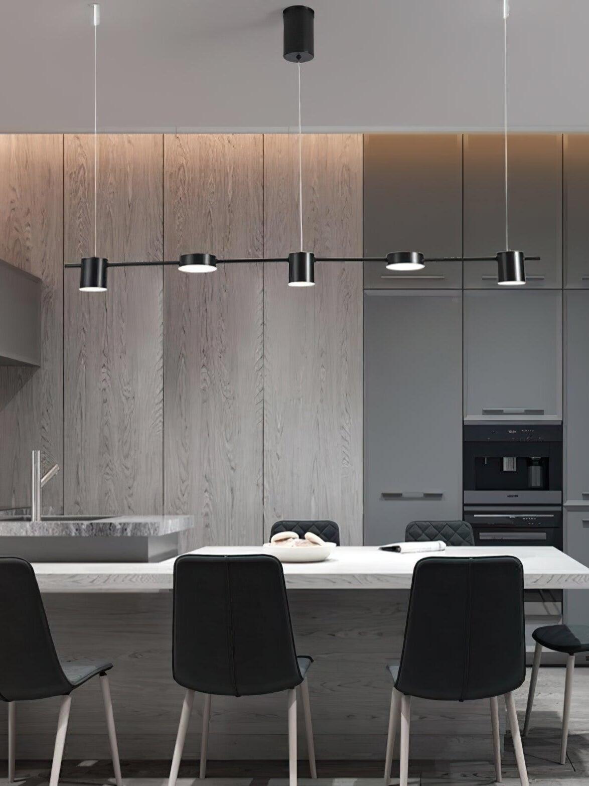 Black disc-and-cylinder fixture over a breakfast counter