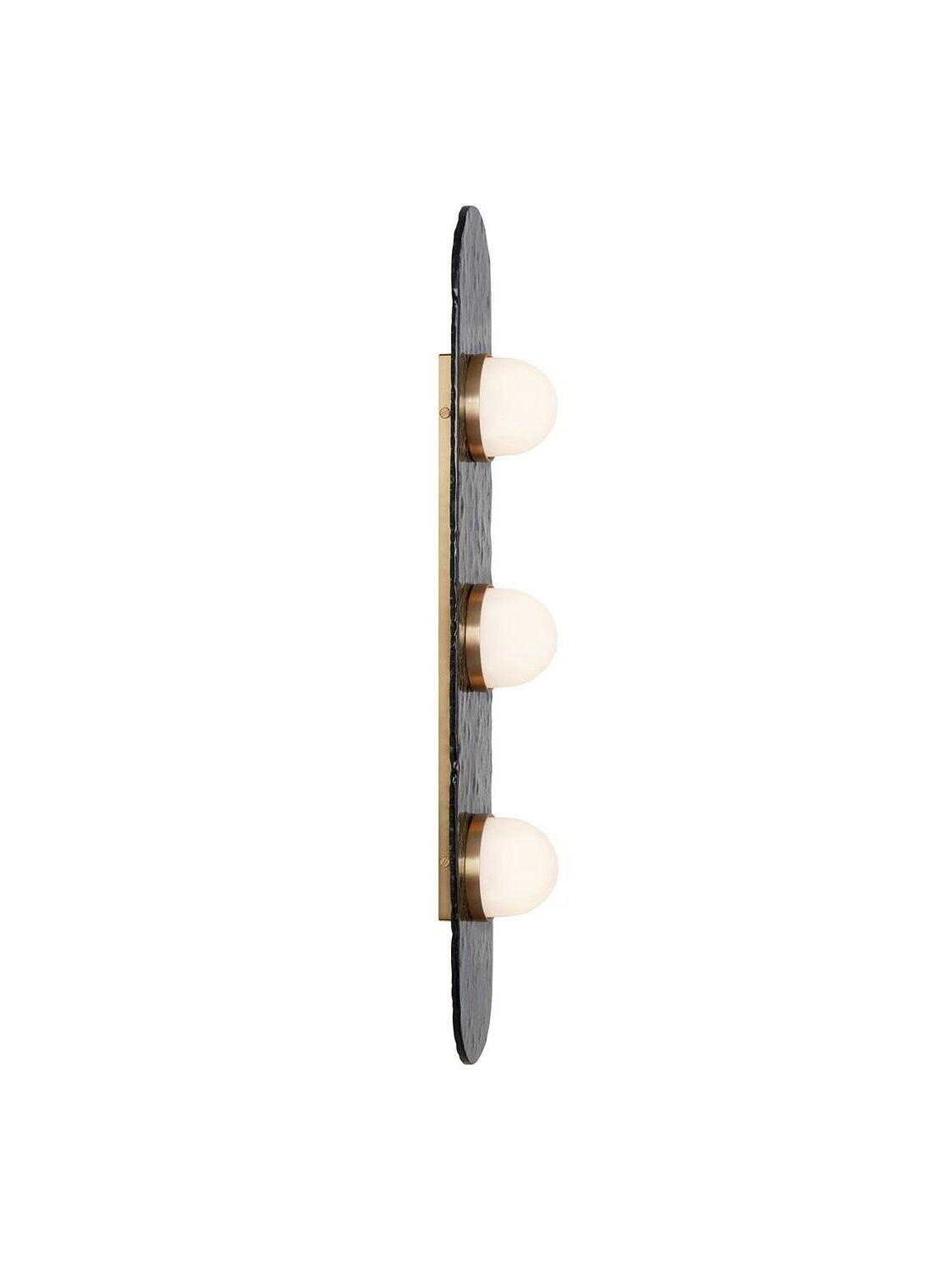 Side profile of the three-light Modulo with white domes spaced along a gold-tone strip