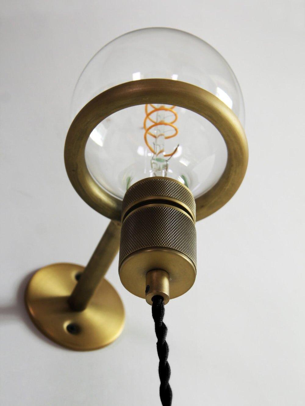 Low view of globe bulb and knurled holder inside ring bracket