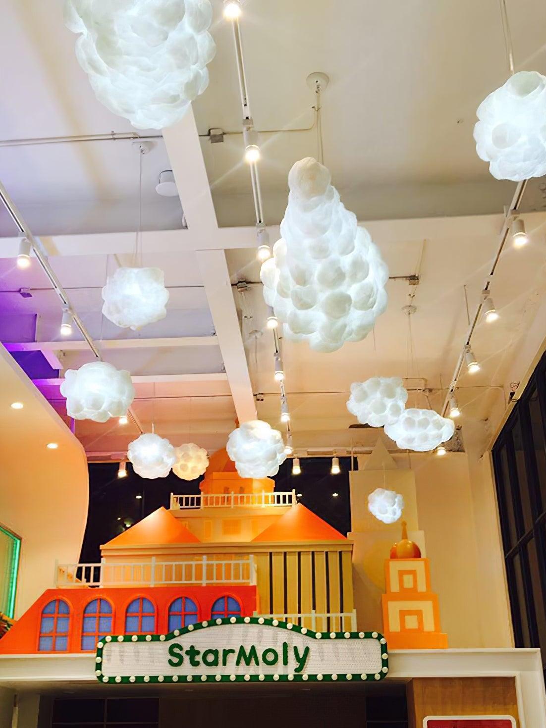 Cloud-shaped lights in a colourful shop display