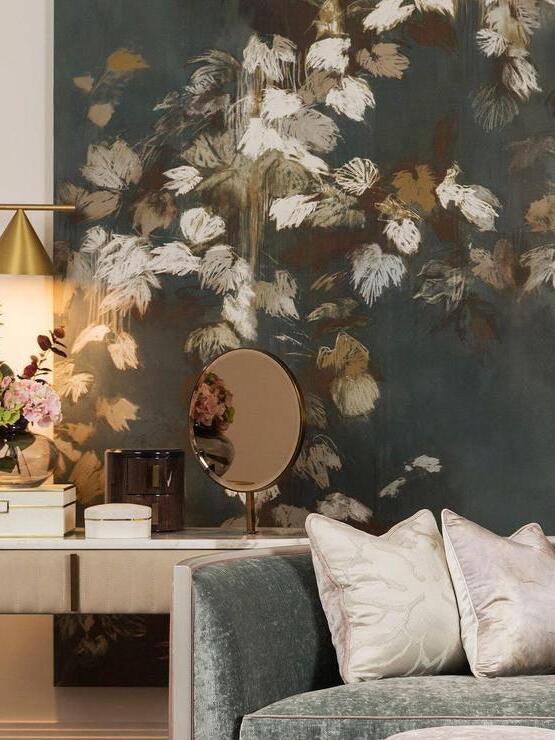 Cropped cone lamp against floral wallpaper above console