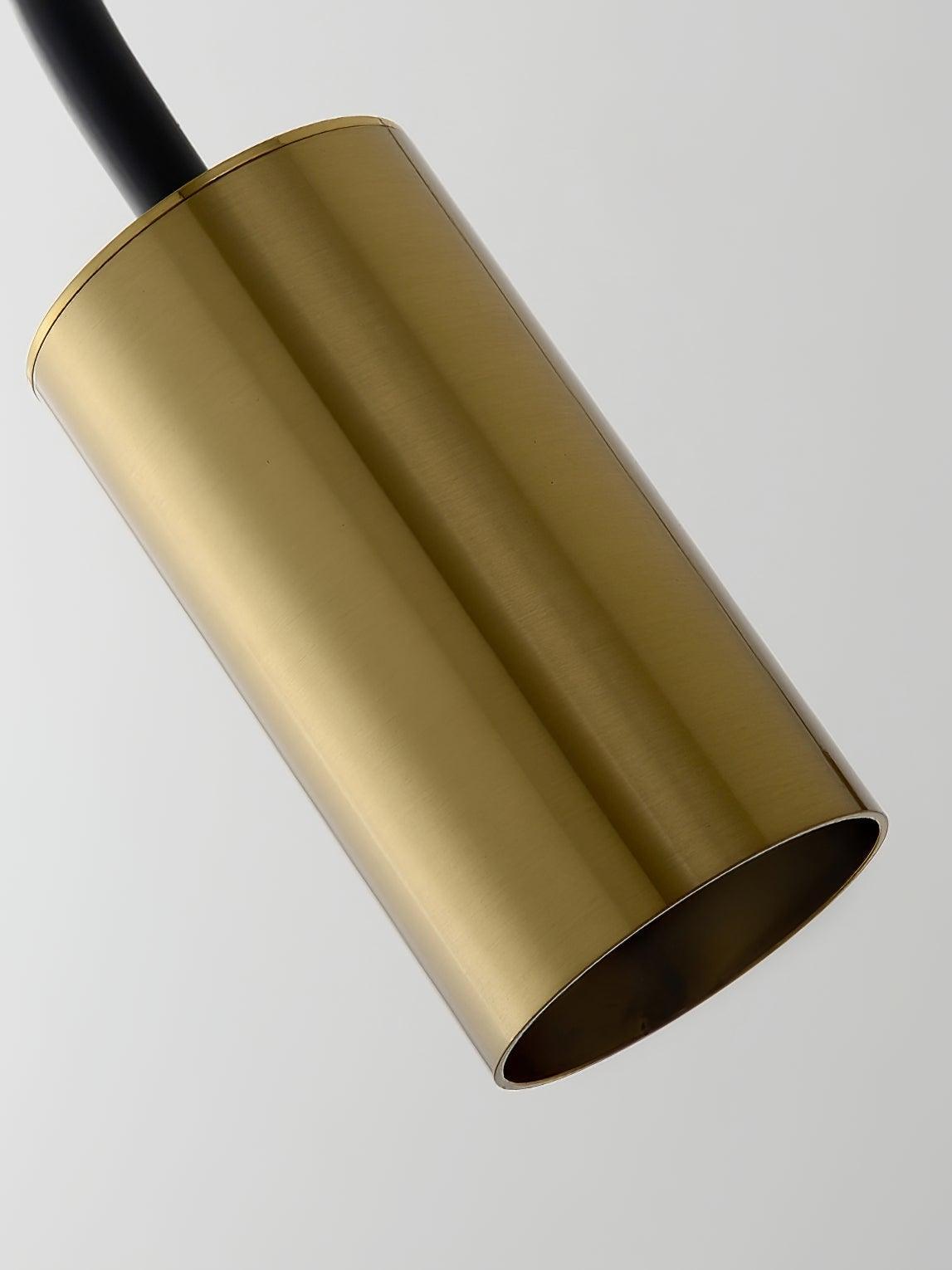 Detail of the gold-finish cylindrical Antonella spotlight casing