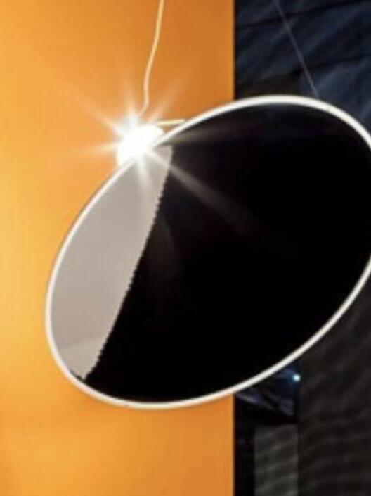 Reflective dark disc photographed at an angle