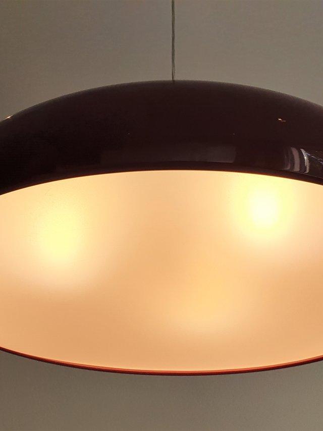 Glowing underside of a dark red dome