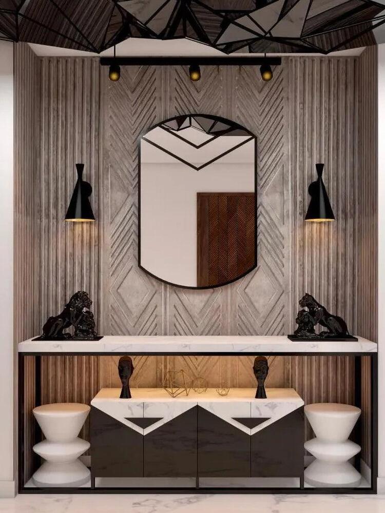 Pair of black conical wall fixtures beside a mirror and basin