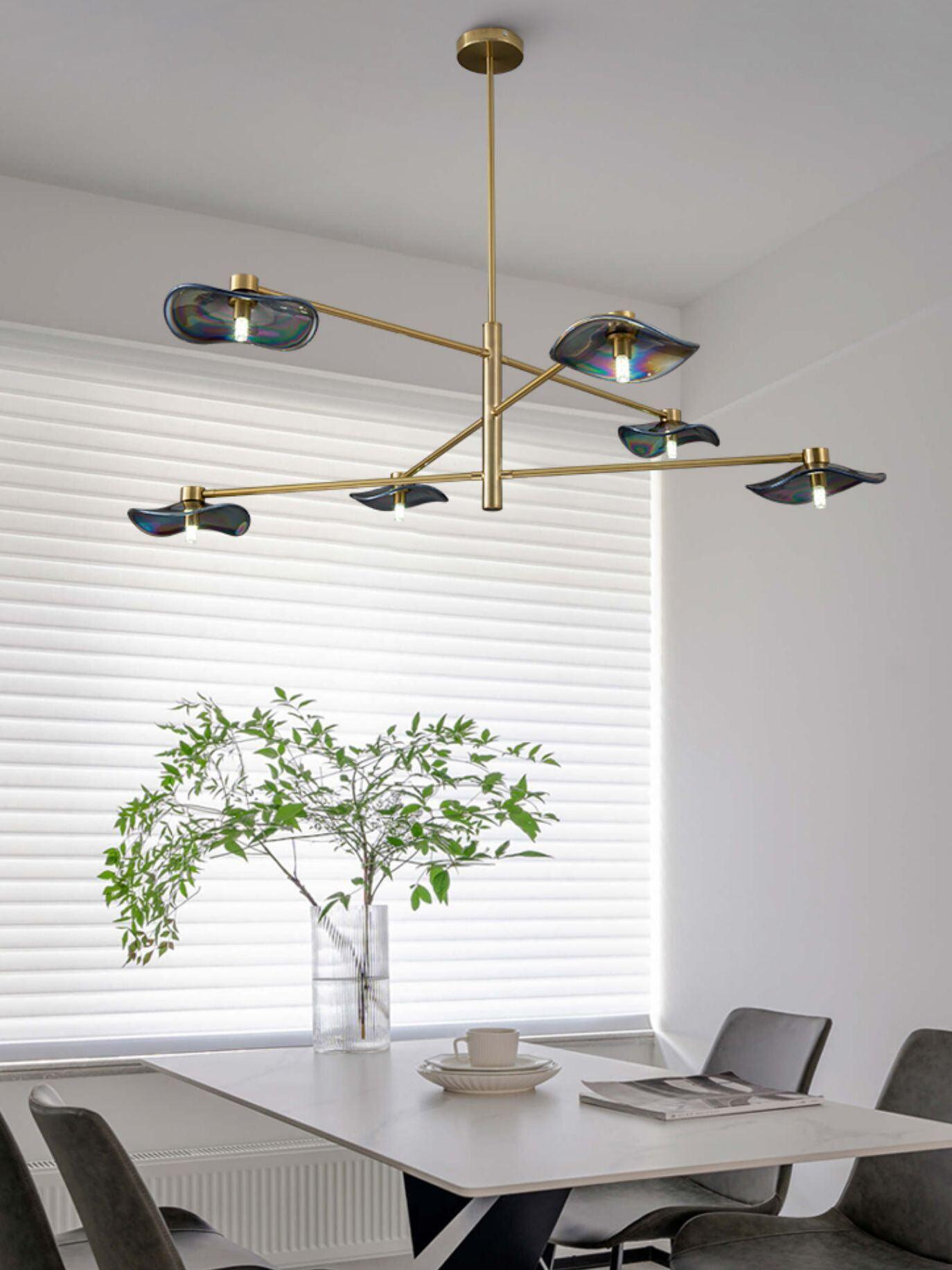 Gold Calla chandelier above a dining table