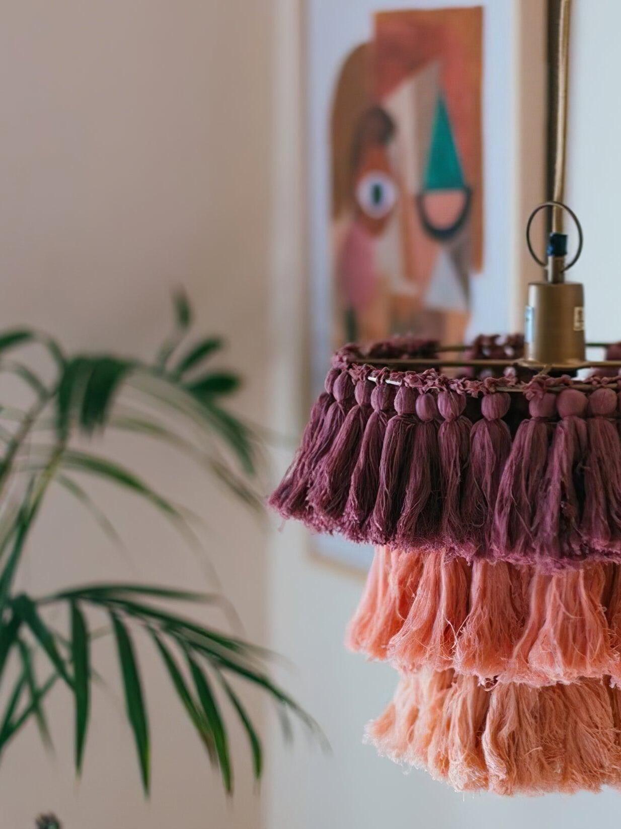 Close-up of burgundy and pink tassel tiers