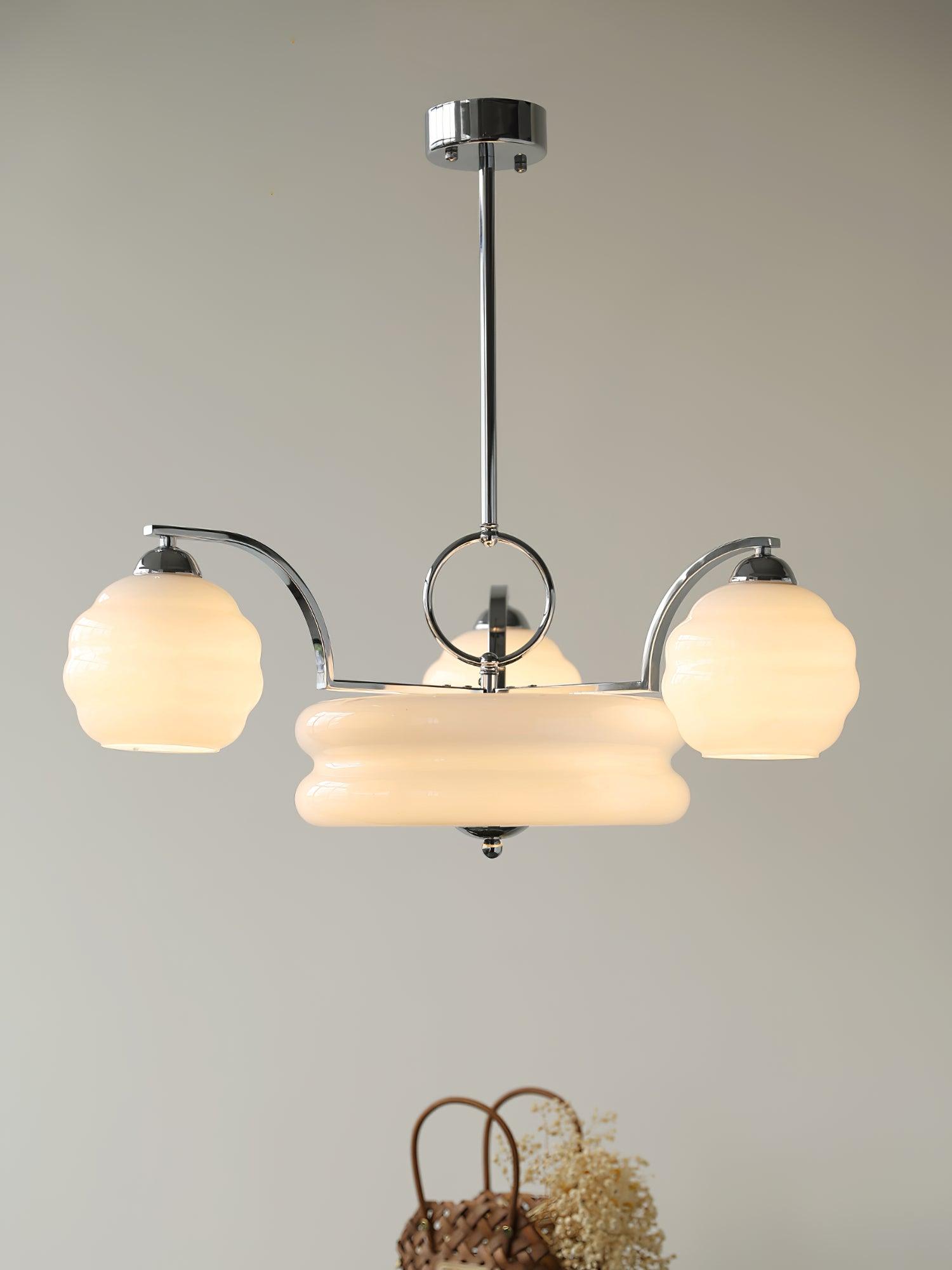 Chrome chandelier with glowing curved glass shades