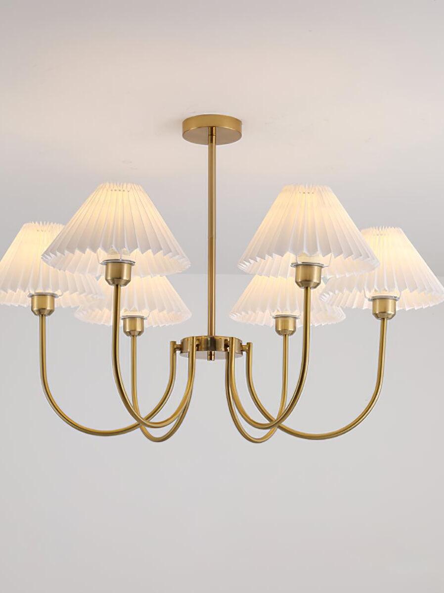 Illuminated multi-shade chandelier with a central rod and rounded gold-tone arms