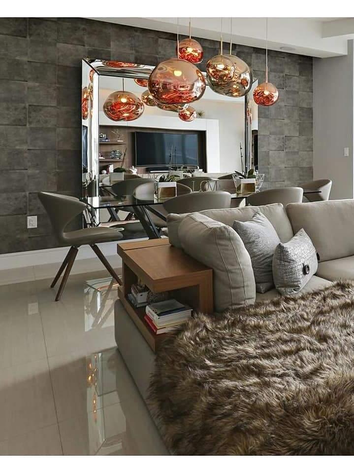 Warm-toned pendant group above a living room