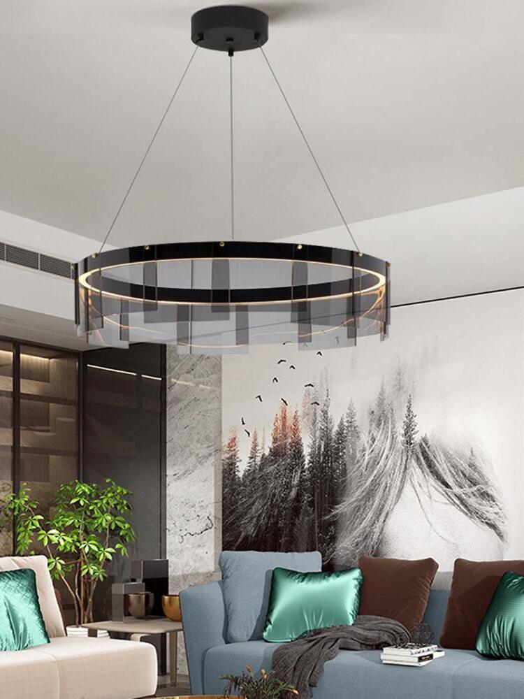 Stratos chandelier above green lounge cushions