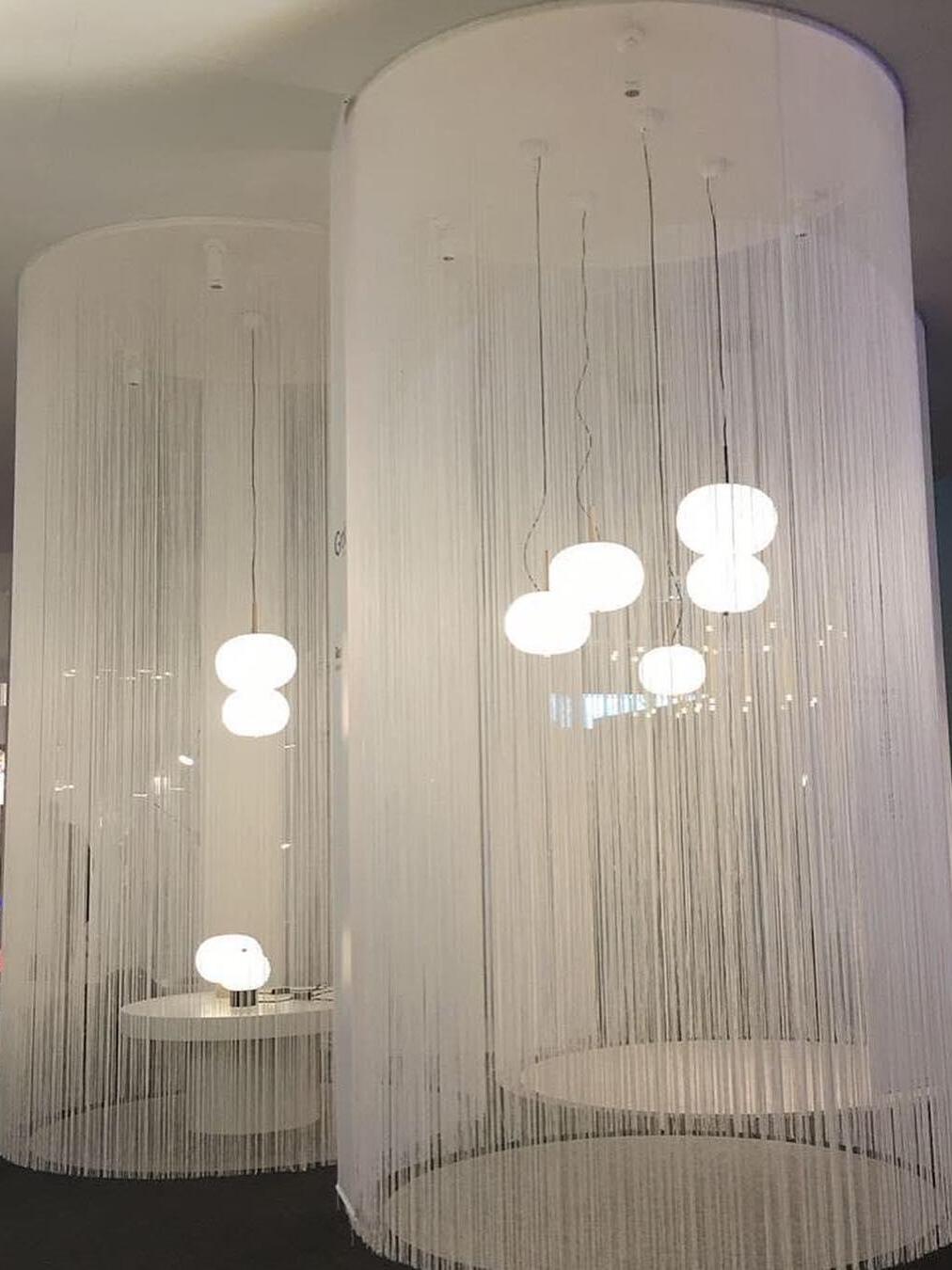 Multiple white globes in a display installation