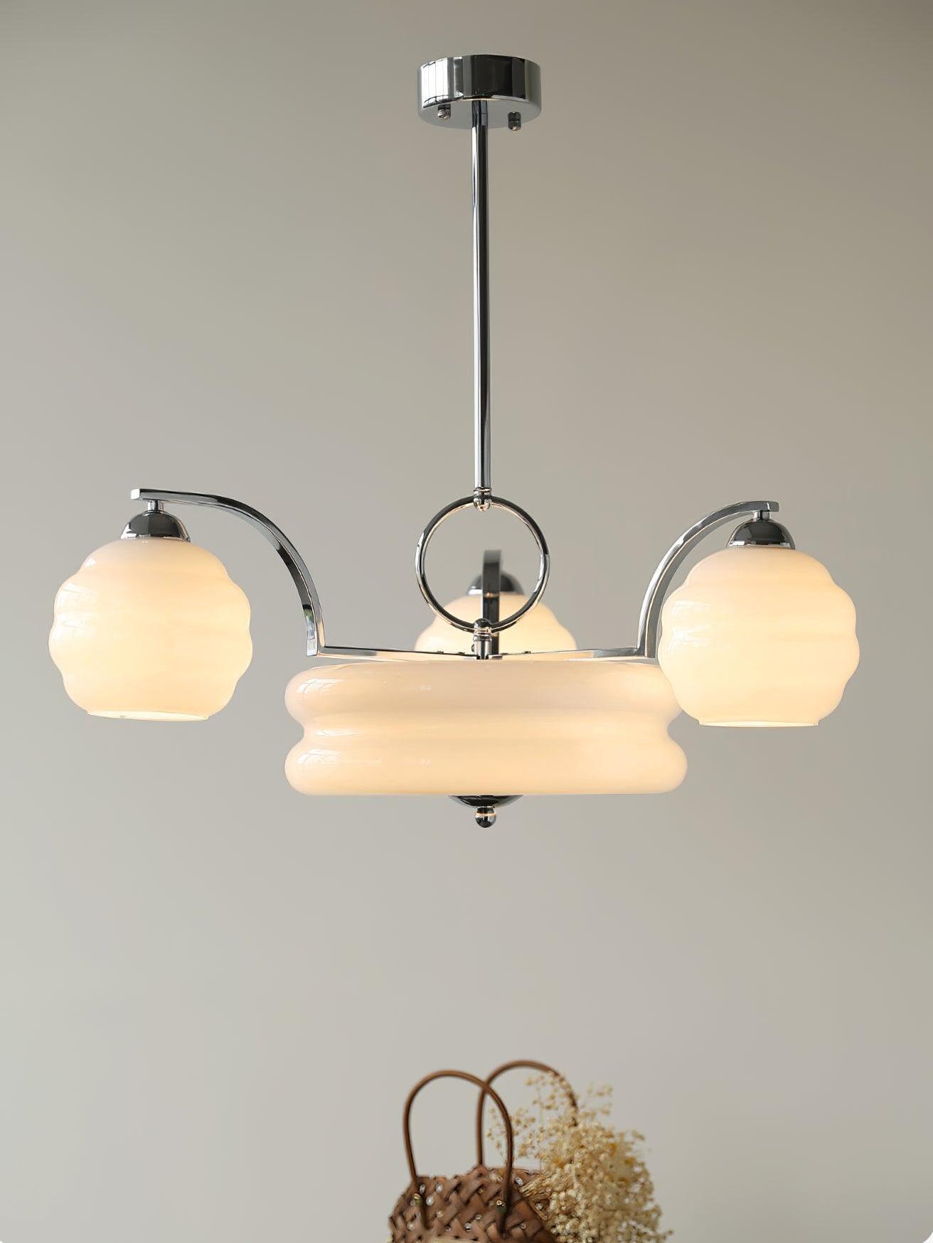 Chrome frame with curved glass shades and central bowl
