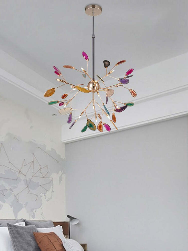 Colourful branching chandelier near a white ceiling