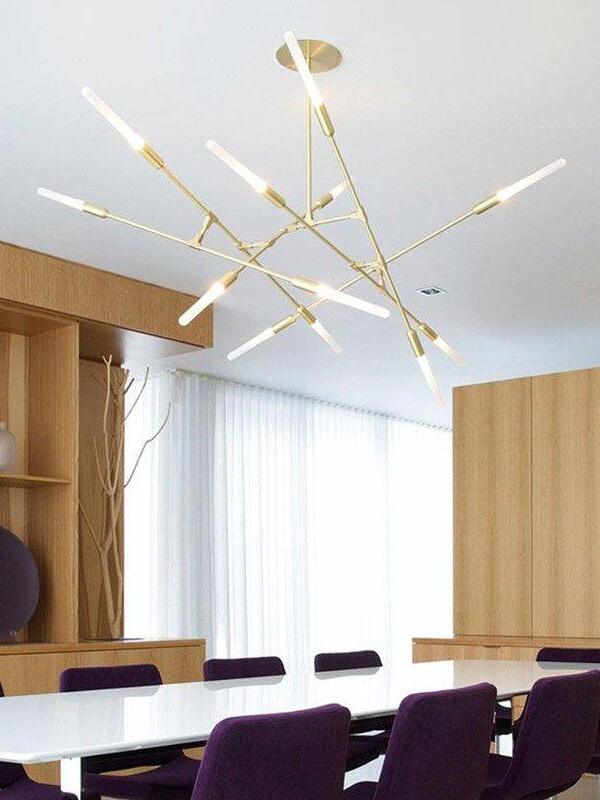 Gold branch chandelier above a dining table
