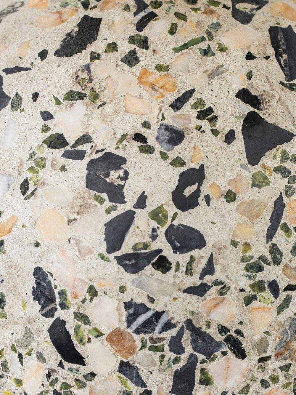 Close dark and muted green terrazzo fragments in pale matrix