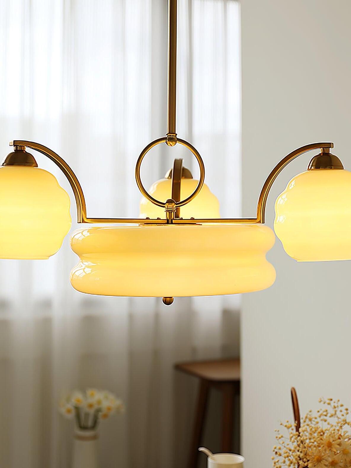 Glowing glass shades around a wide central light