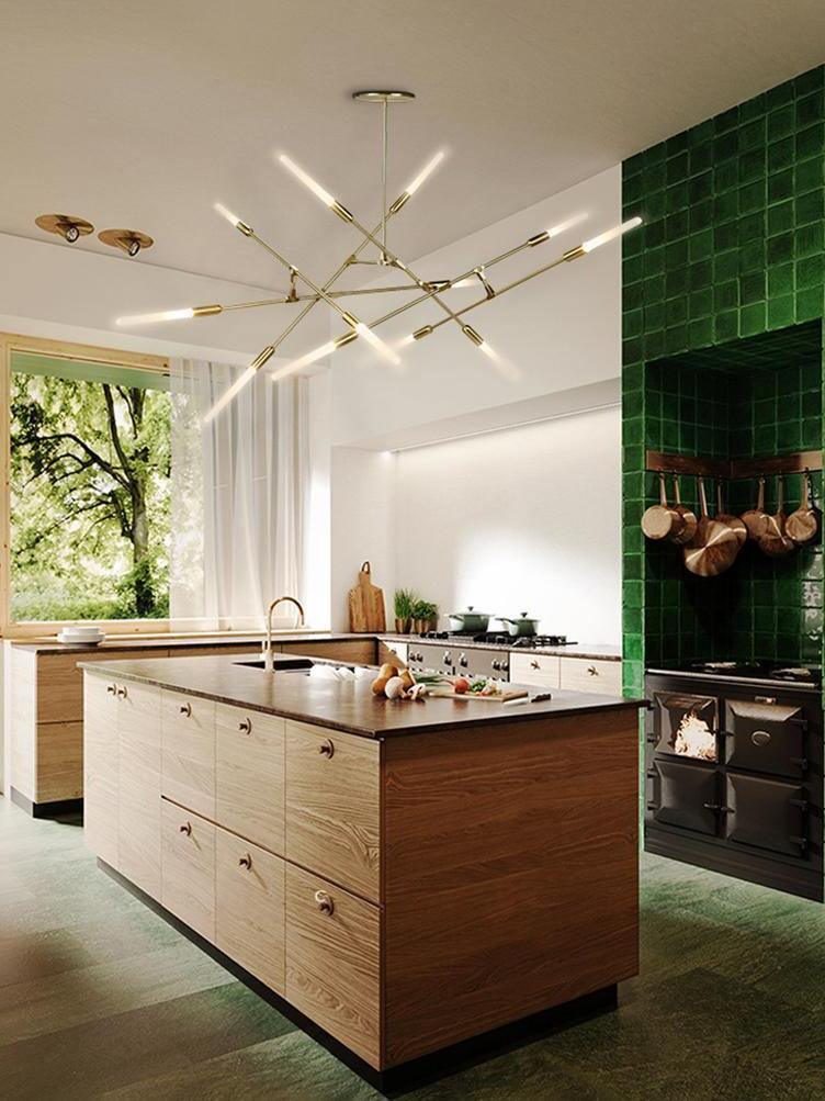 Horizontal Gold chandelier over a kitchen island