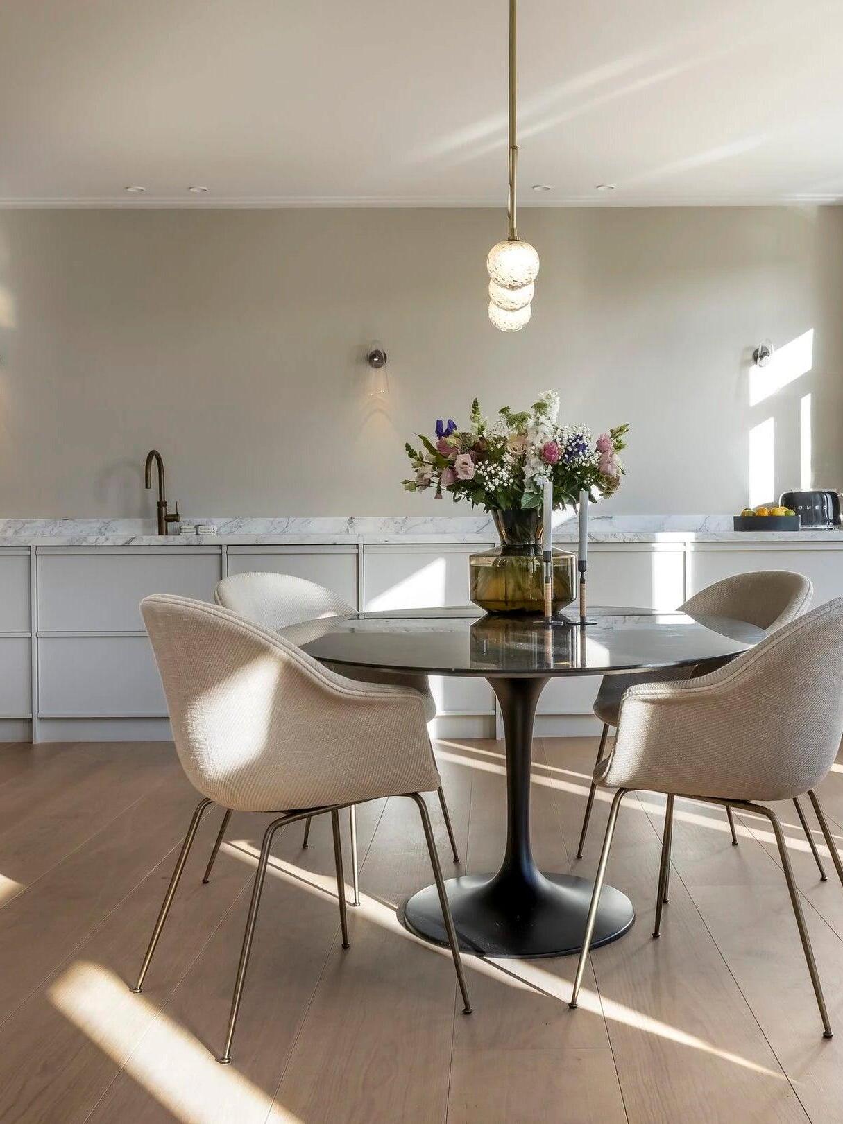 Wall-light detail in a bright dining-room scene