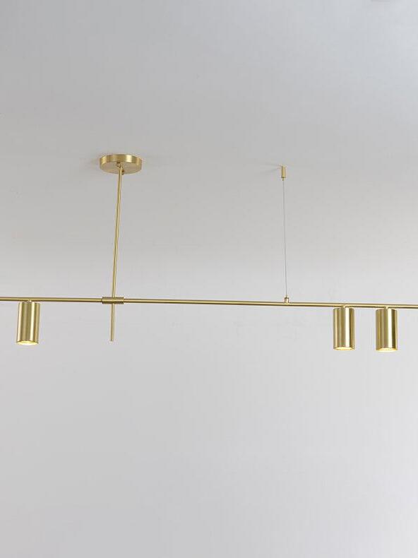 Gold-coloured linear chandelier with three downward-facing cylindrical heads