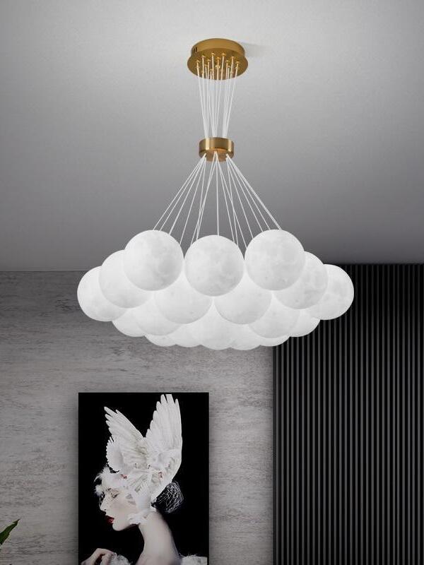 Unlit pale sphere cluster above indoor wall art