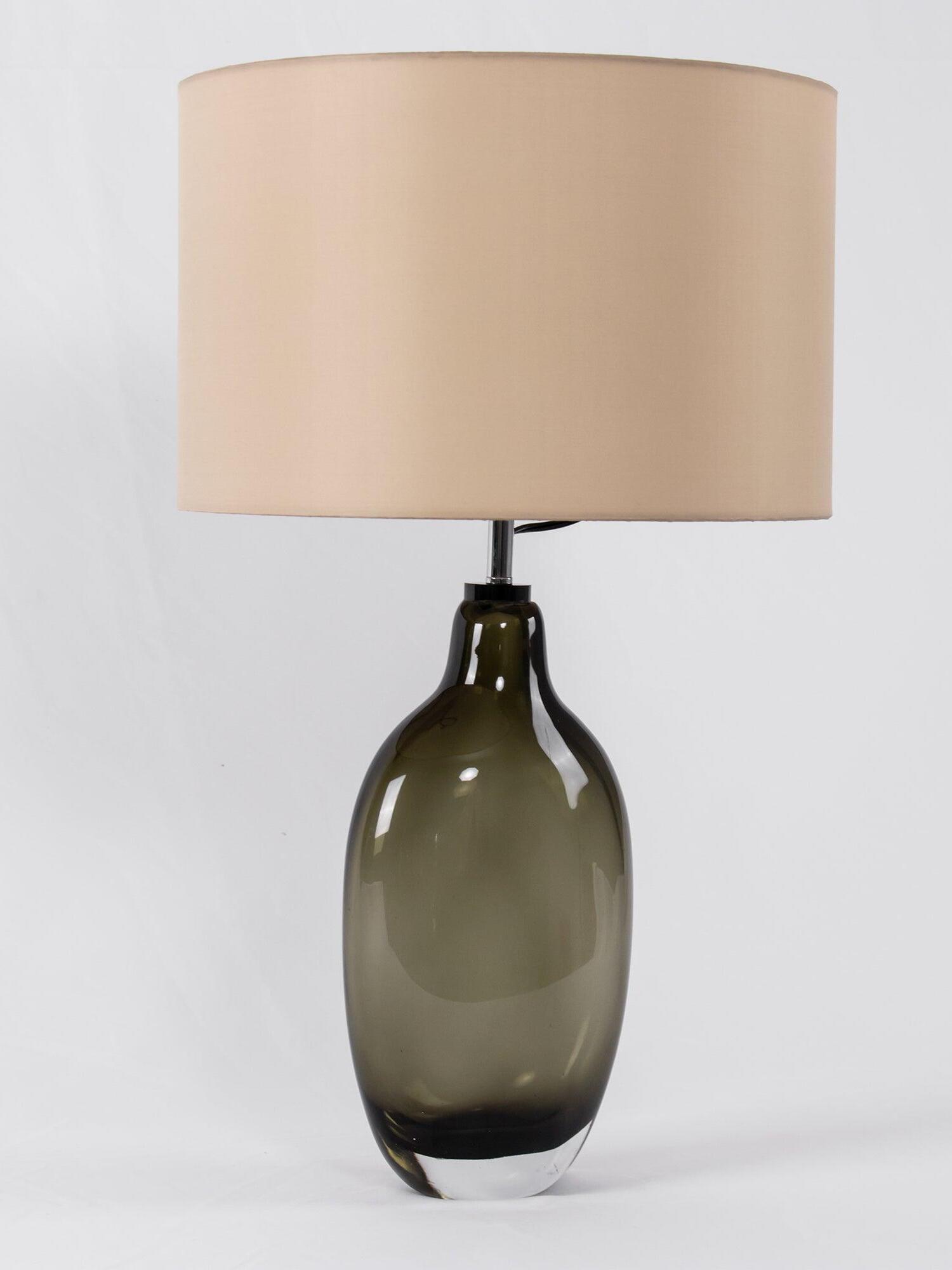 Three-quarter view of rounded smoky base and drum shade