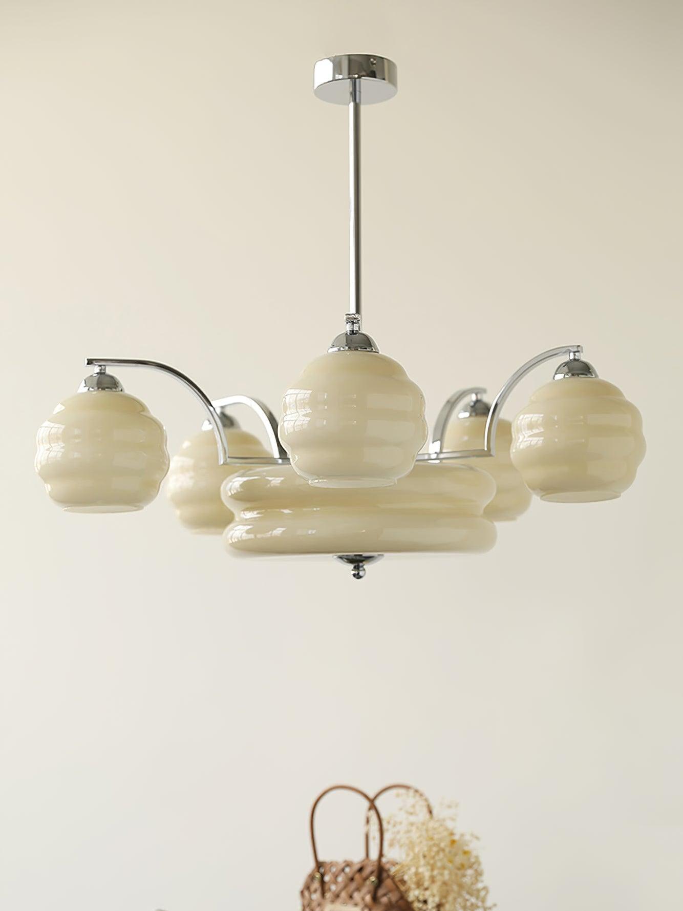 Chrome and Beige glass chandelier on a ceiling rod