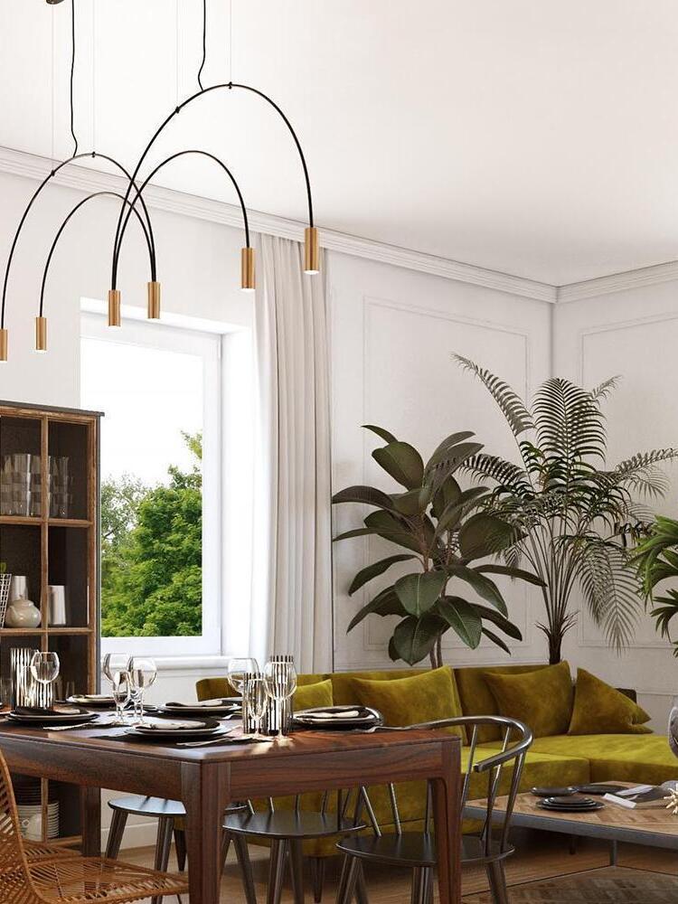 Gold-head arch light above a round table