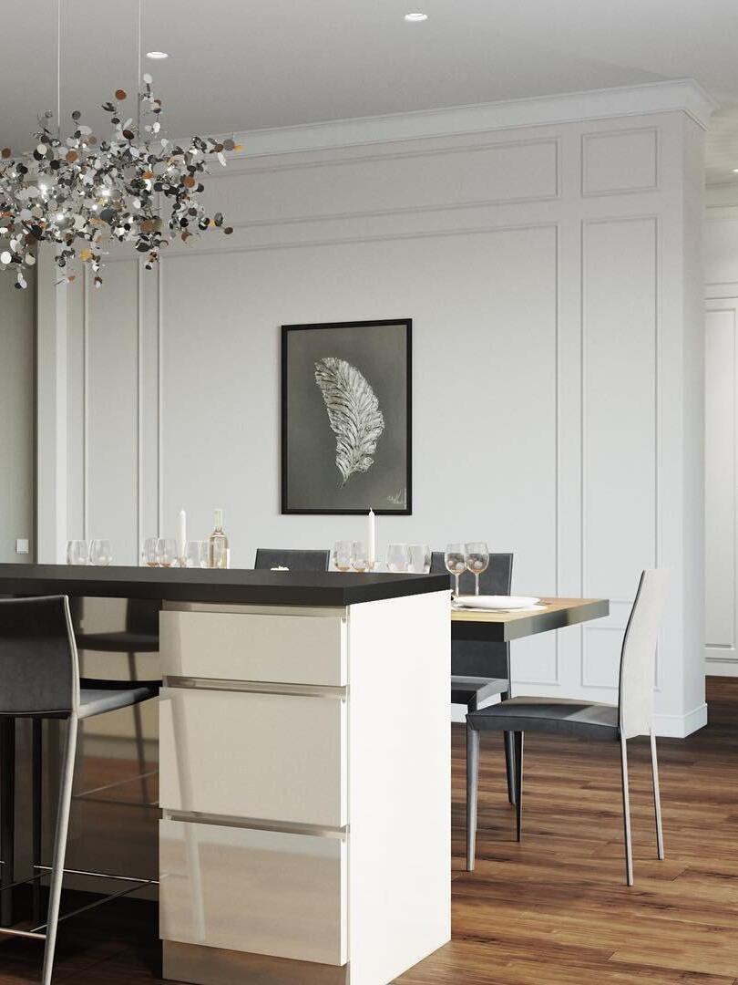 Silver disc-cluster chandelier above a dining table in a pale room